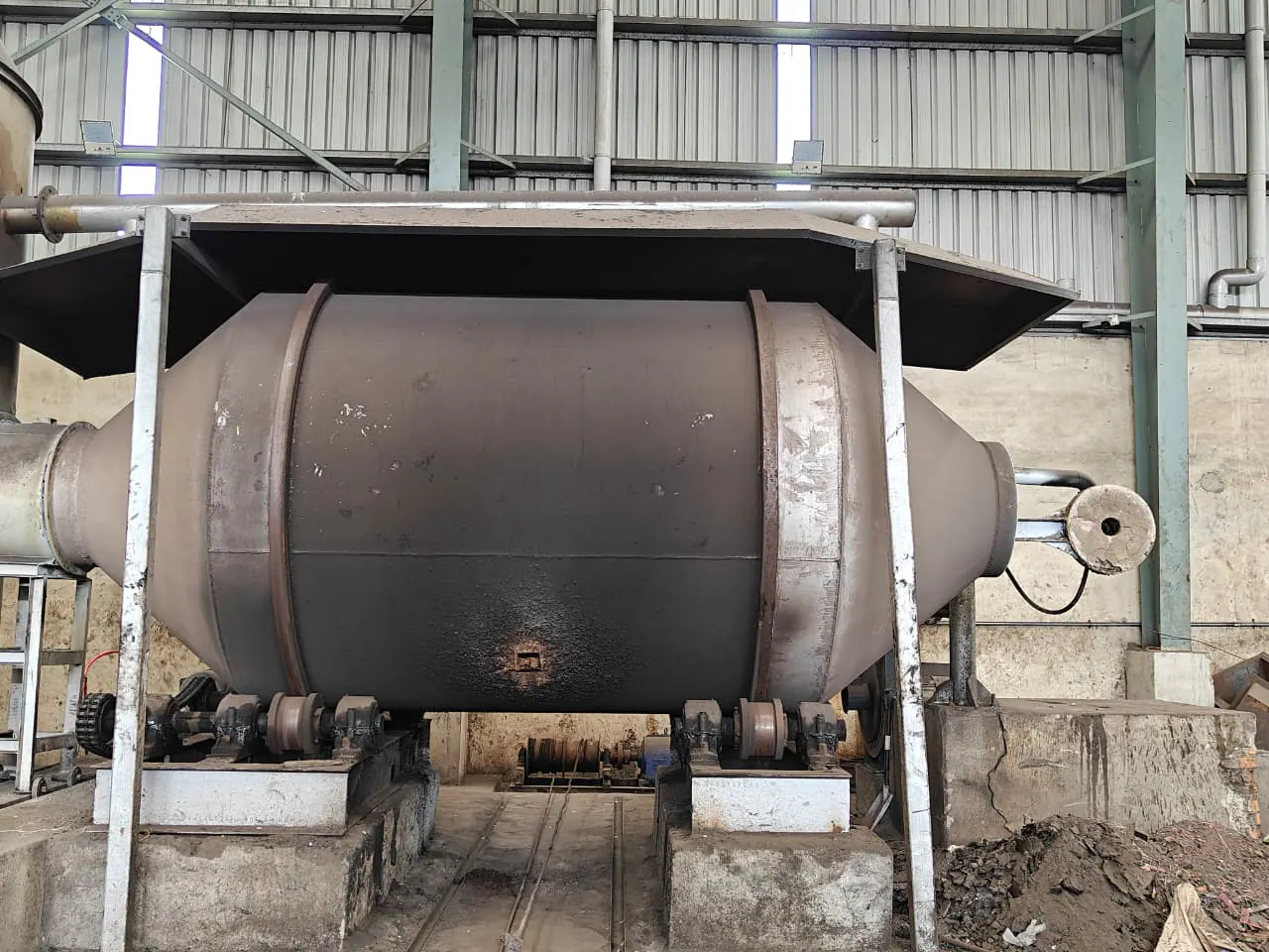 Front project view of a fabricated rotary furnace body and its supporting structure